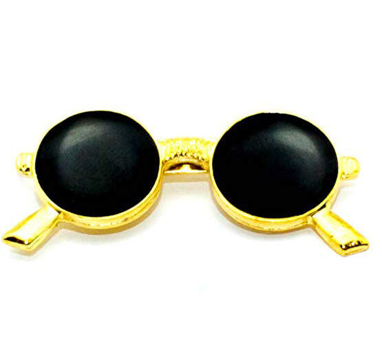 Three John Lennon dark sunglasses design brooches in black enamel and gold setting.