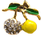 Small summer fruits brooch with yellow enamel and green leaves.