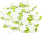 White ribbon bow trim with detailed fringe flowers for sewing.