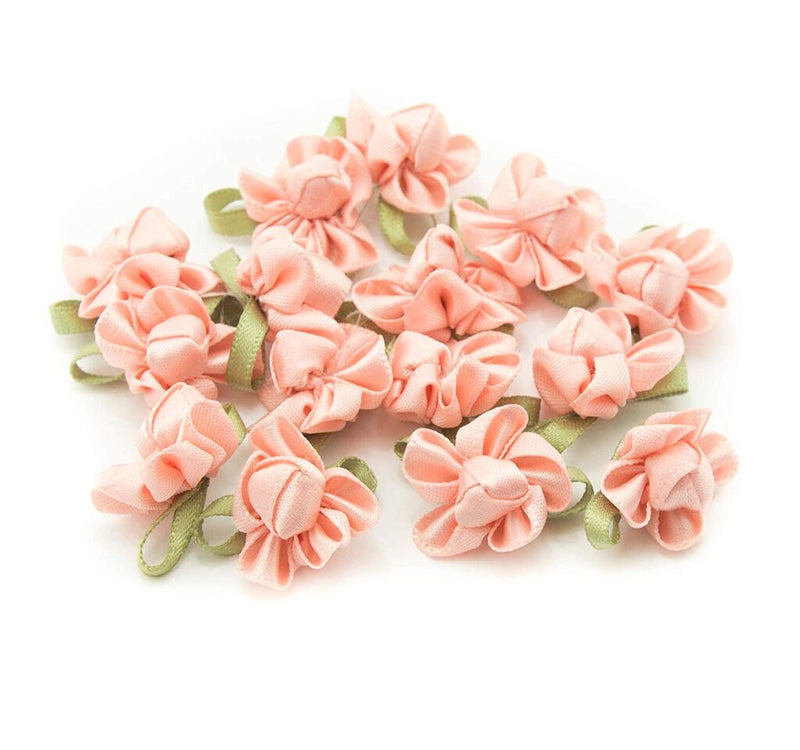 Salmon pink ribbon bow trim with coloured fabric flower.