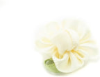 Pack of 20 cream ribbon bows with fabric flowers for embellishment.