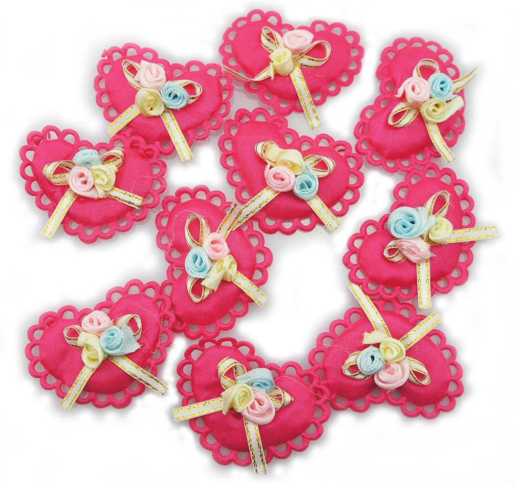 Close-up of a bright pink heart trim featuring a bow and floral design.