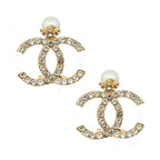 Two elegant crystal inlaid brooches with pearl effect beads.