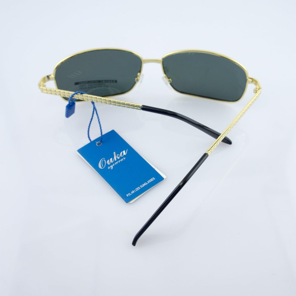 Side view showing the gold frames of the sunglasses