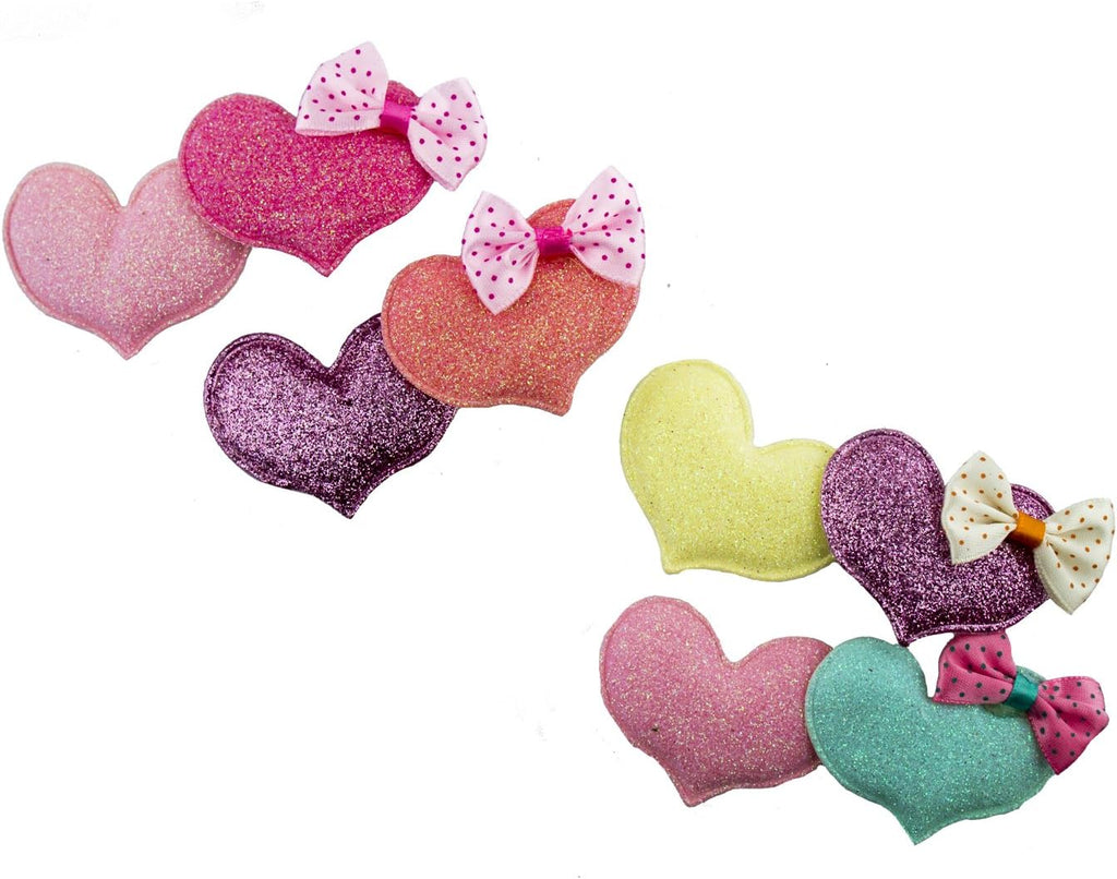 Four pastel sparkly heart hairclip barrettes arranged together.