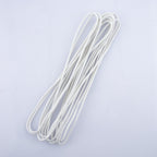 Black round sewing elastic displayed with sewing tools