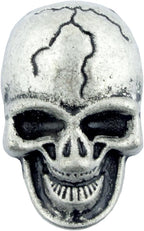 Close-up of a grey metal skull stud showing detail