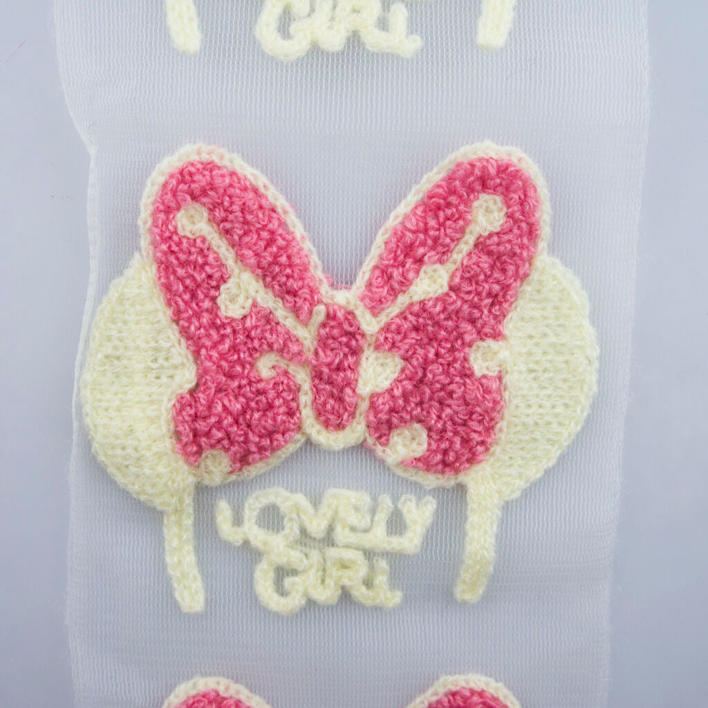 Display of 'Lovely Girl' butterfly design trim on fabric
