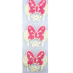 Close-up of pink butterfly decorative trim with net backing