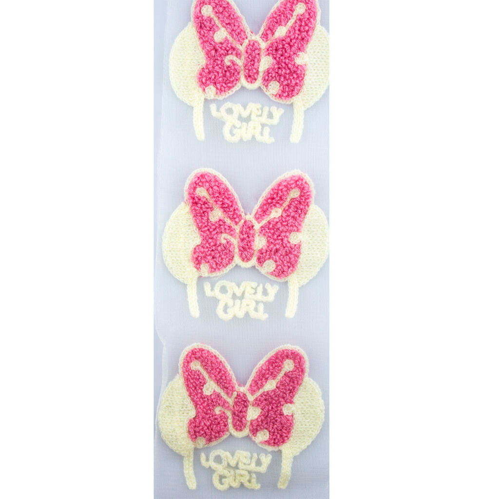Close-up of pink butterfly decorative trim with net backing