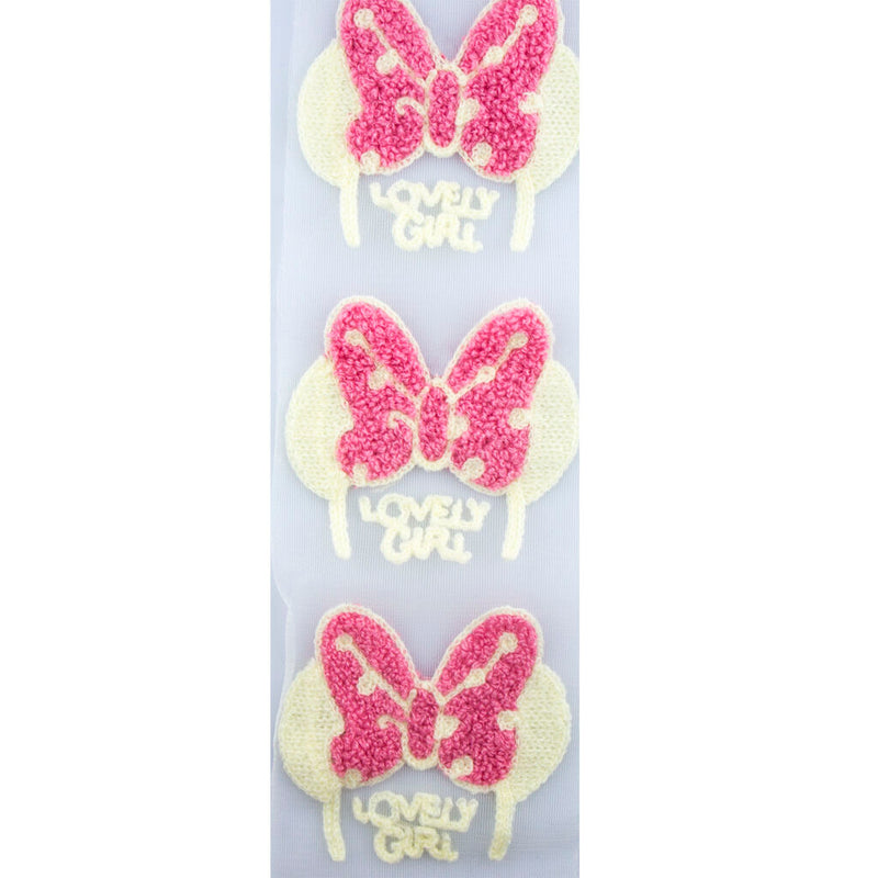 Close-up of pink butterfly decorative trim with net backing