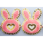 Close-up of sequins on the pink bunny and heart decorative trim.