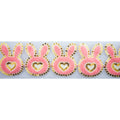 Half metre of bunny heart design fabric trim with net backing.