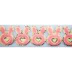 Half metre of bunny heart design fabric trim with net backing.