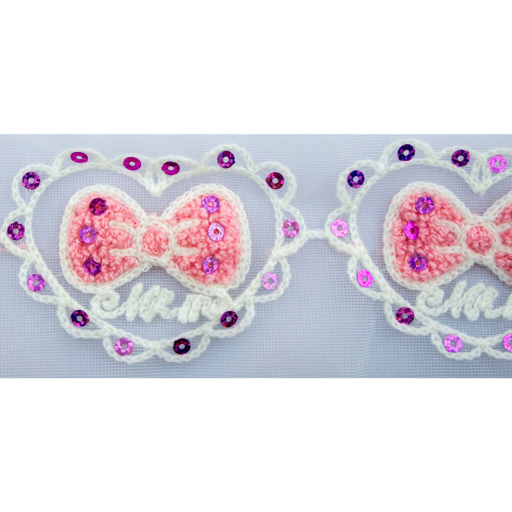 Decorative trim with net backing and purple sequins.