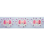 Close-up of pink bow in a heart design fabric trim.