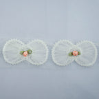 Pack of 10 heart trims with net backing for sewing.