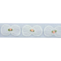 Close-up of white bow and pink flower decorative trim.