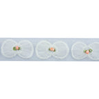 Close-up of white bow and pink flower decorative trim.