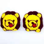 Seven pieces of teddy bear decorative trim on a net backing.