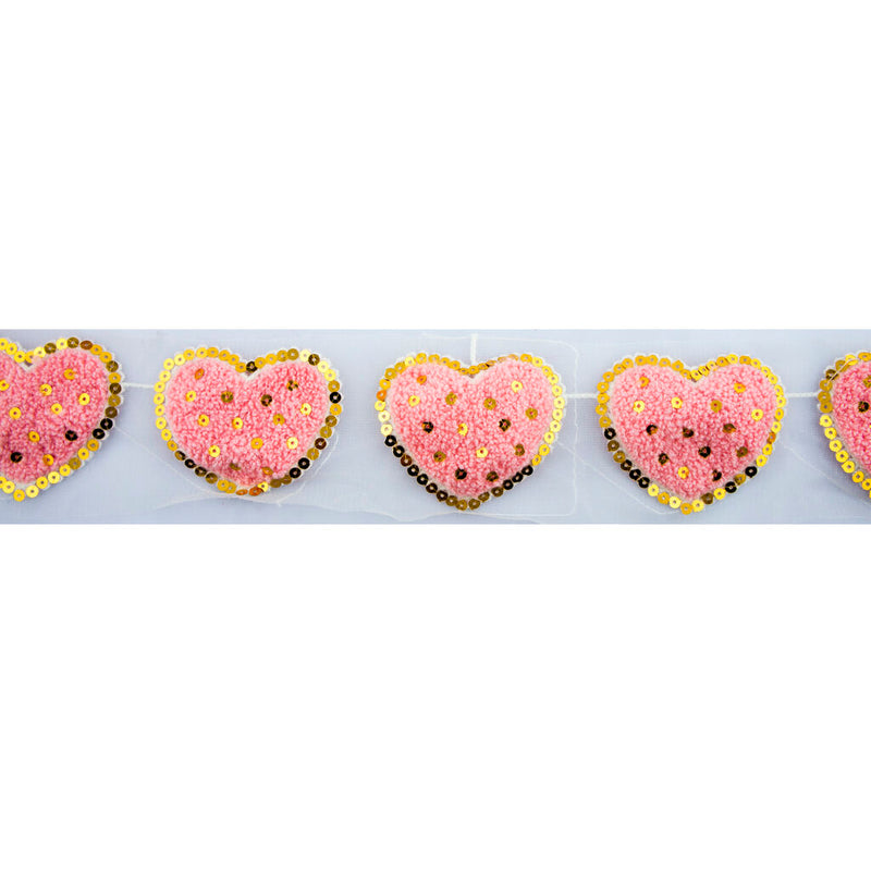 Half metre of decorative pink heart trim with sequins