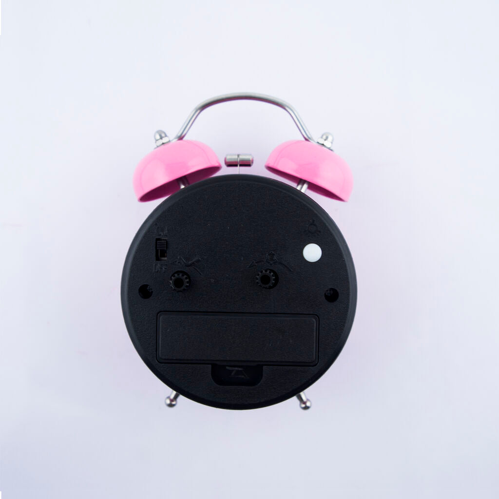 Close-up of the Hello Kitty Ballerina clock face with night-light button.
