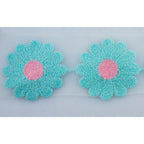 Display of 14 pieces of flower trim, each measuring 6.4x6.4cm.