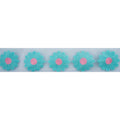 Close-up of blue and pink knitted flower decorative trim on net backing.