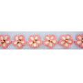 Knitted pink flower decorative trim with net backing.