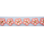 Knitted pink flower decorative trim with net backing.