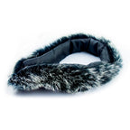 Luxurious black and white fake fur collar displayed on a mannequin.