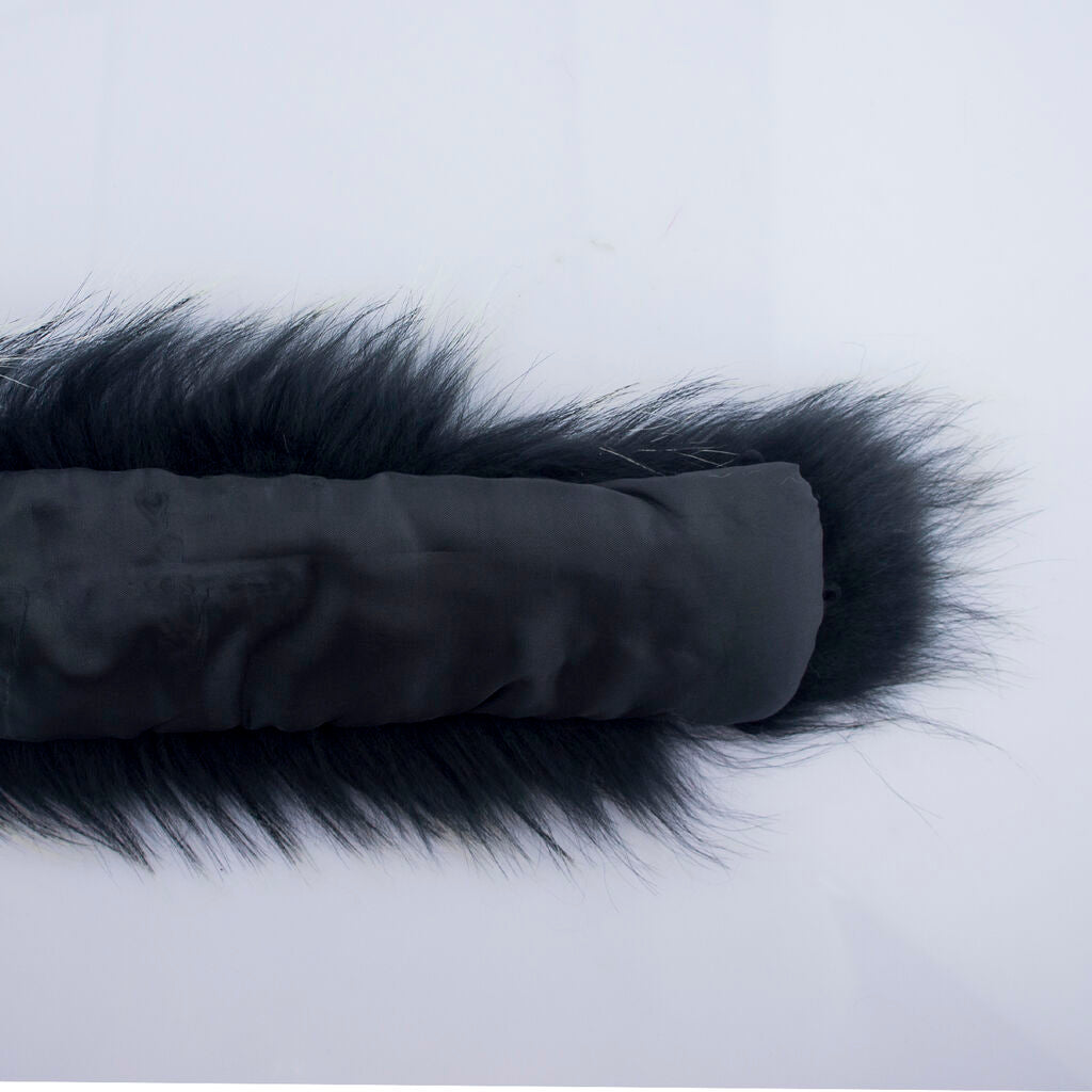 Black and white fake fur collar laid flat on a surface