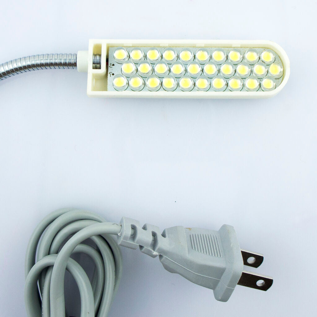 Close-up of the LED sewing machine lamp showing its size and design.