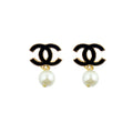 Set of 2 stylish brooches featuring pearl effect beads and black enamel motif