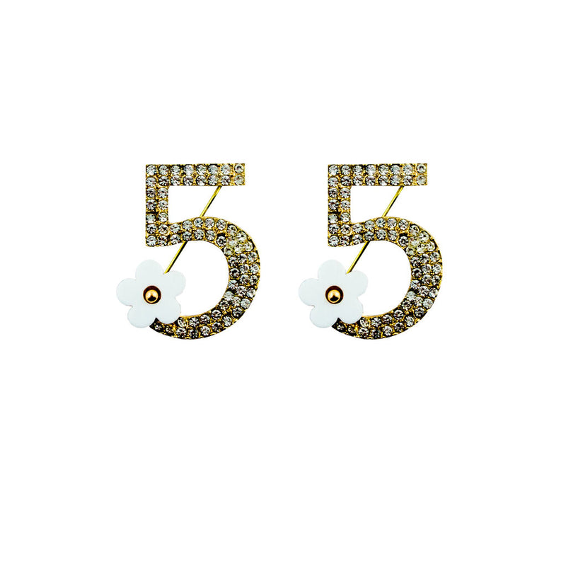 Stylish number 5 brooch with clear crystals and white flower design.