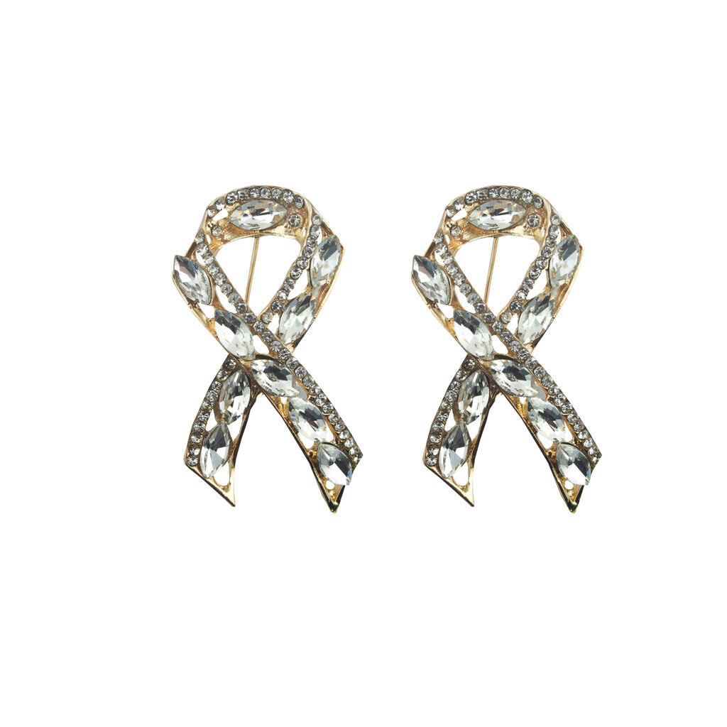 Stylish ribbon brooch with clear crystals in gold tone setting.