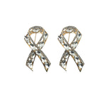 Stylish ribbon brooch with clear crystals in gold tone setting.