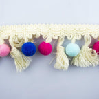 Off white tassel variant of the colourful pom pom trim.