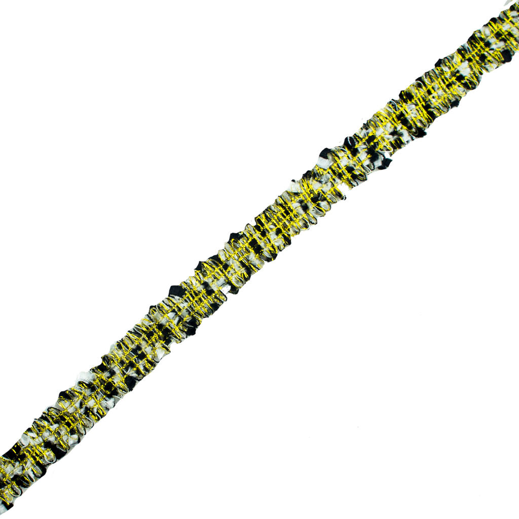Black and white fabric sew in trim with gold thread on display.