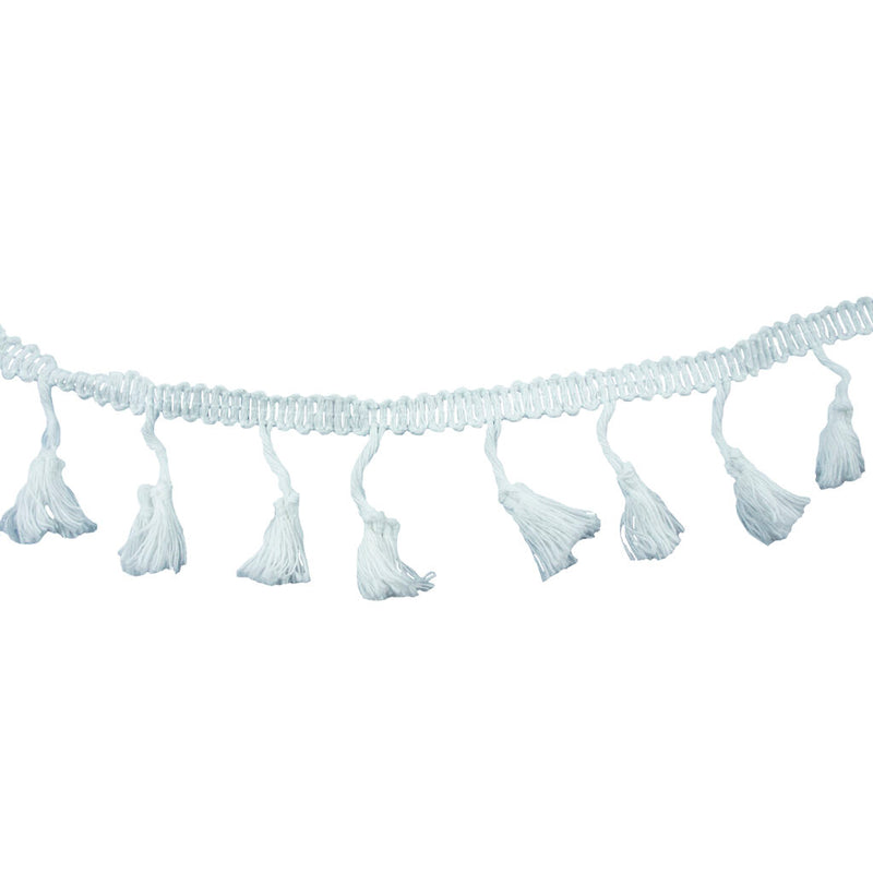 White cotton tassel trim displayed on a flat surface.