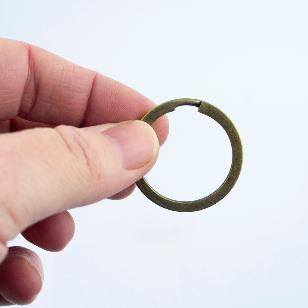 Close-up of a 30 mm vintage gold tone metal keyring.