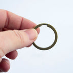 Close-up of a 30 mm vintage gold tone metal keyring.