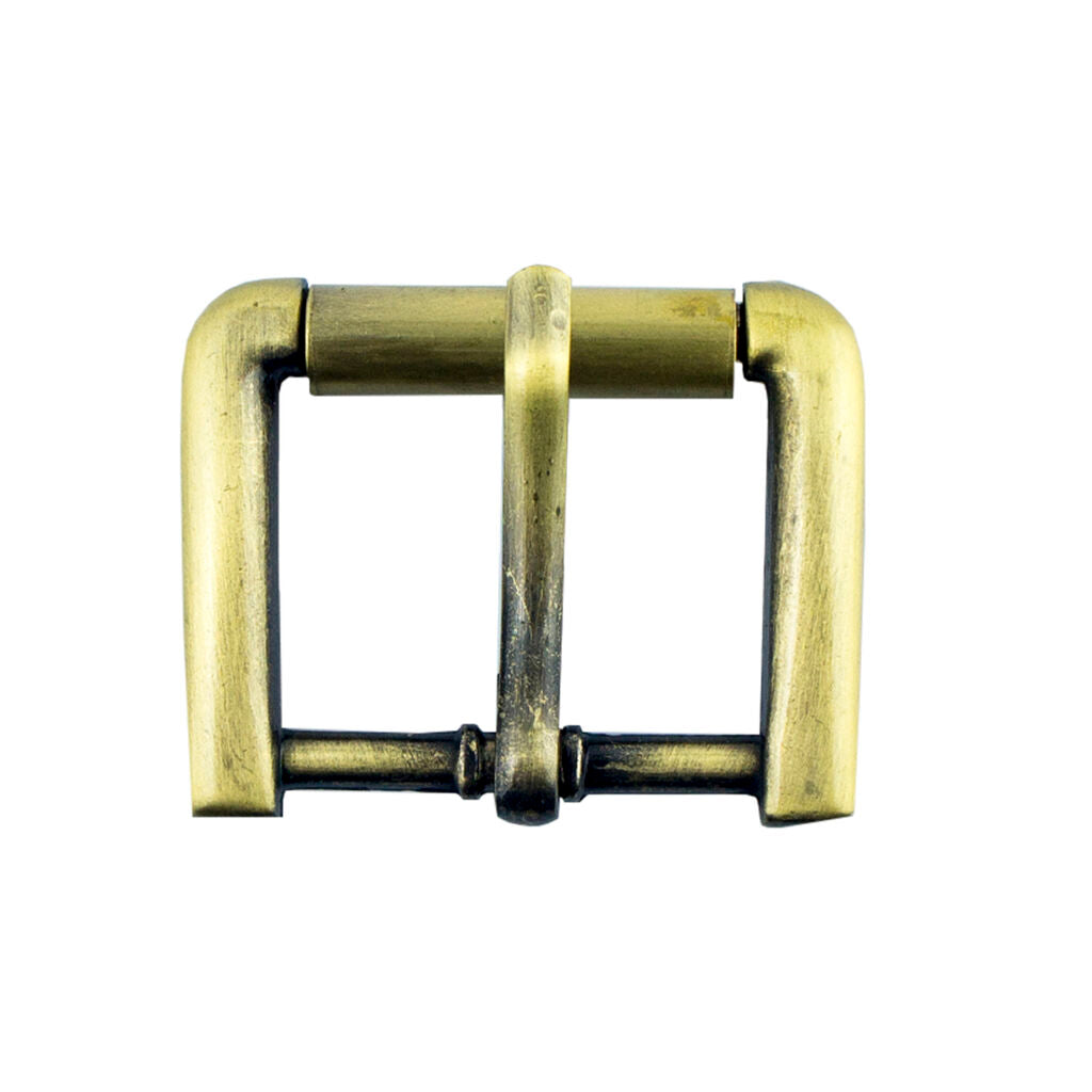 Close-up of a vintage gold square metal buckle on a fabric background.