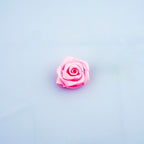 Close-up of 17 mm baby pink rose ribbon trim on a soft background