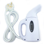 Steamer placed on a table with clothes ready for ironing