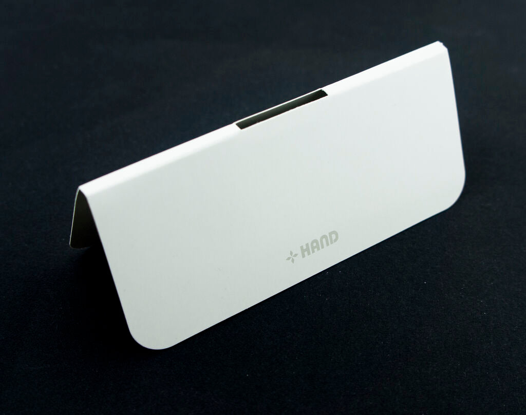 Stack of white fabric sample header cards ready for use