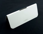 Stack of white fabric sample header cards ready for use