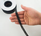 Spool of black bias tape showing its 10 mm width.