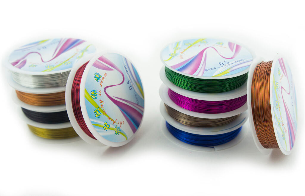 Close-up of silver and gold craft wire rolls.