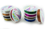Close-up of silver and gold craft wire rolls.